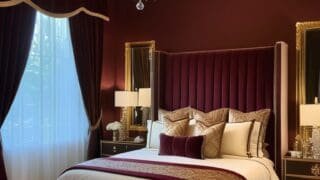 Featured image: Luxurious burgundy bedroom with velvet headboard, golden accents, crystal chandelier, and elegant decor